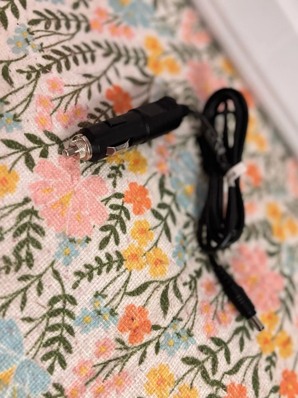 12V DC vehicle power adapter commonly used to charge portable devices